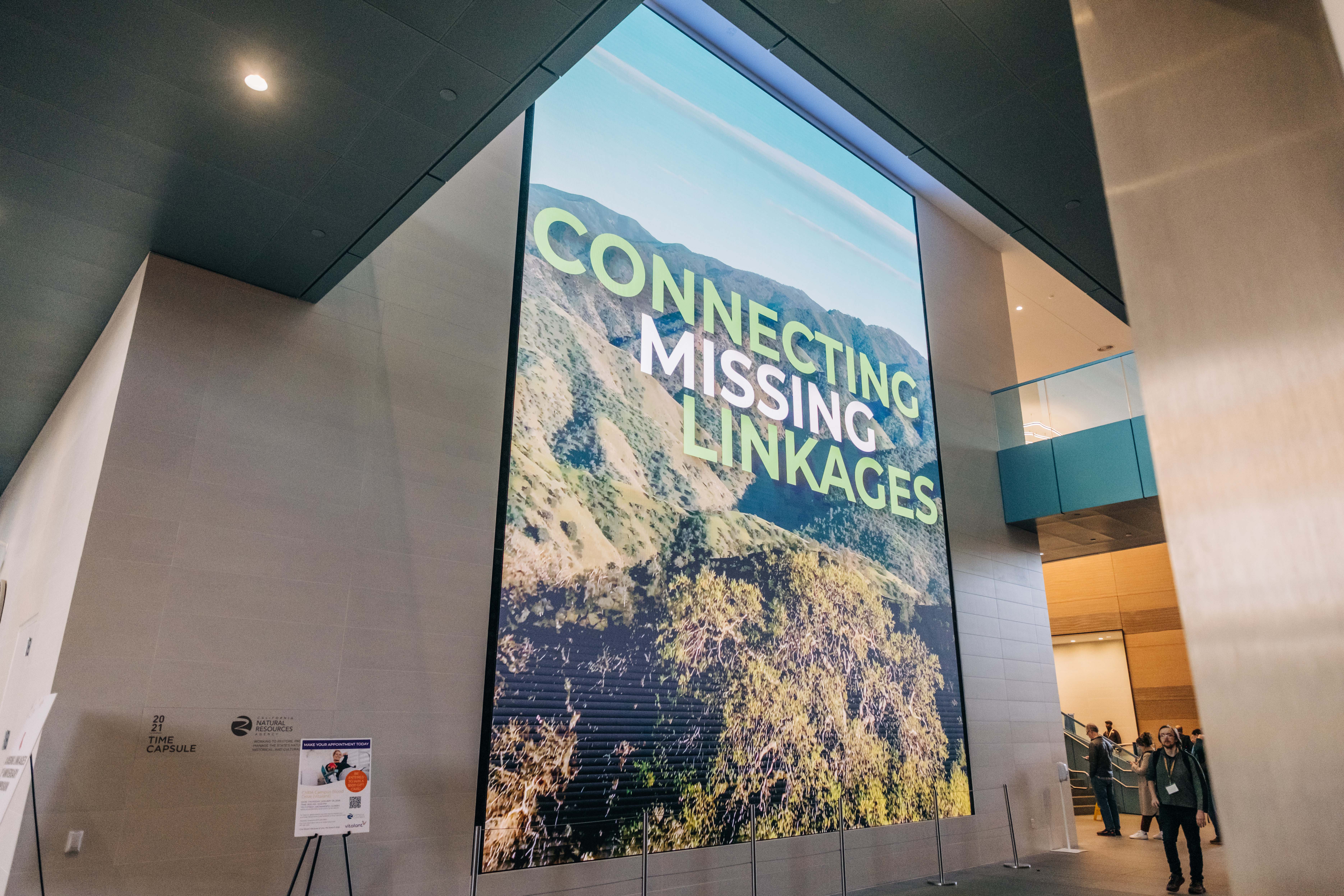 Connecting Missing Linkages video on a large screen. 